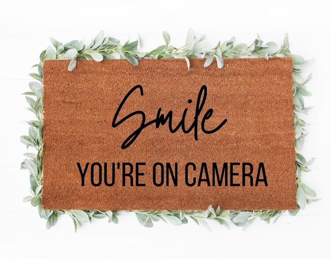 SMILE - YOU'RE ON CAMERA